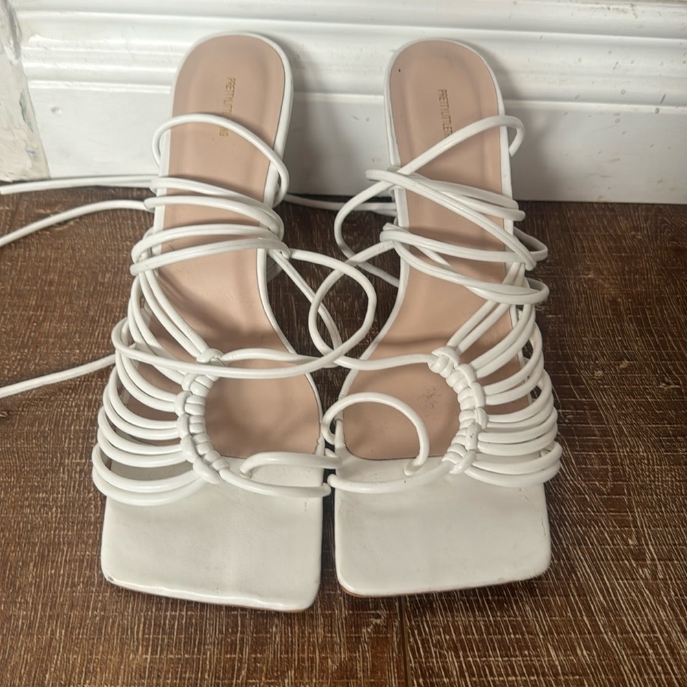 White strappy lace up heels